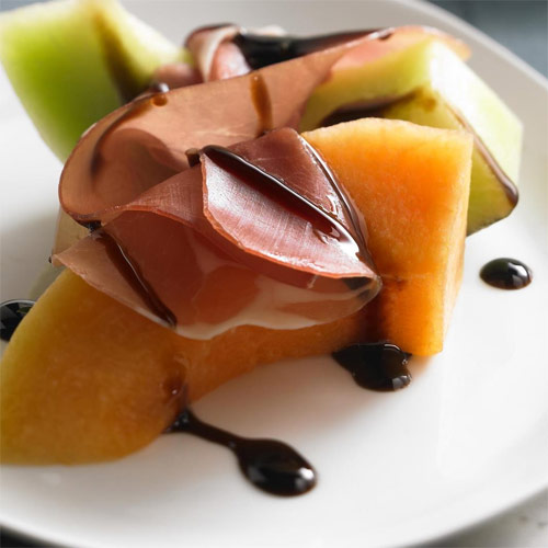 Melon and Prosciutto with Ruby Cranberry Drizzle